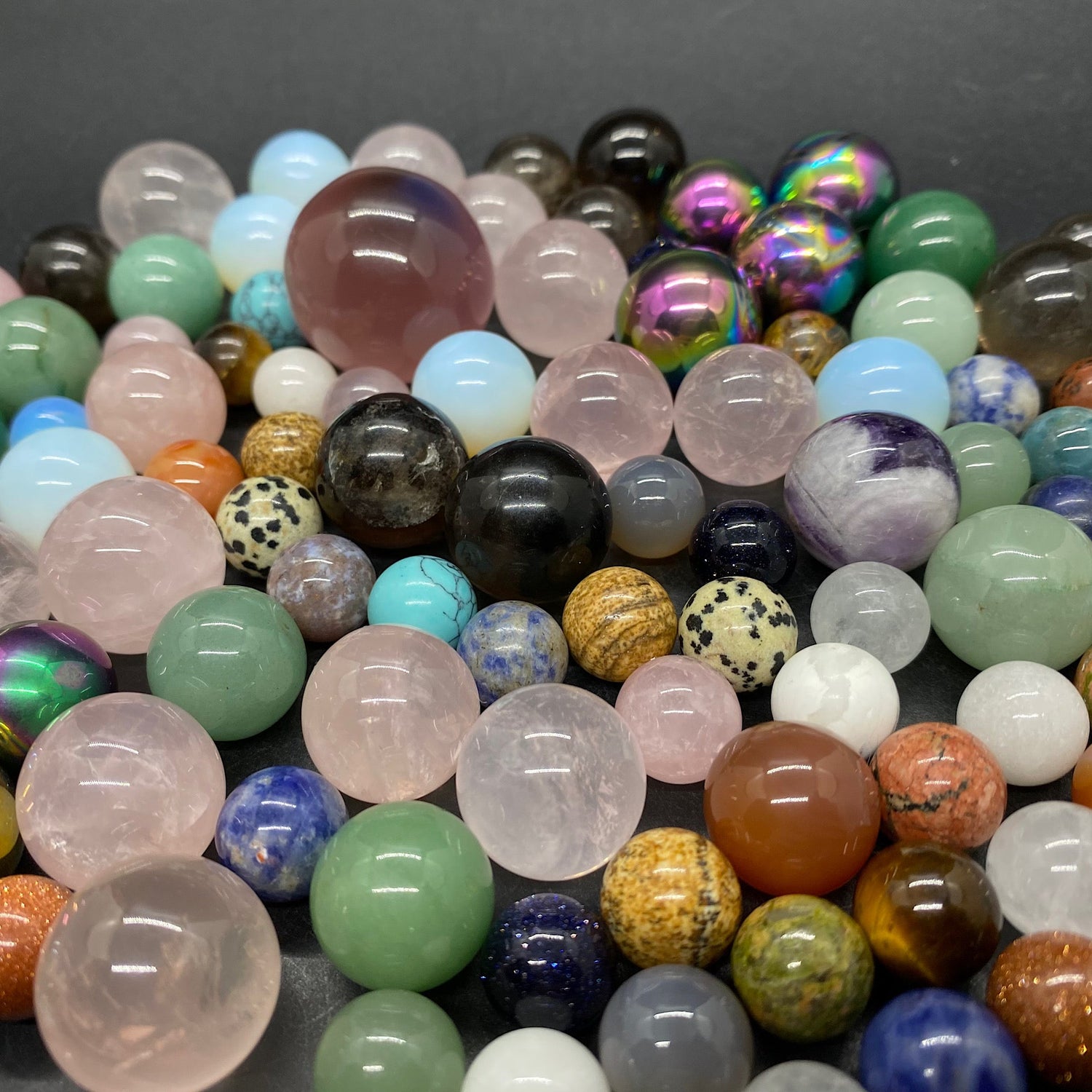 close up view of many crystal spheres of different sizes together