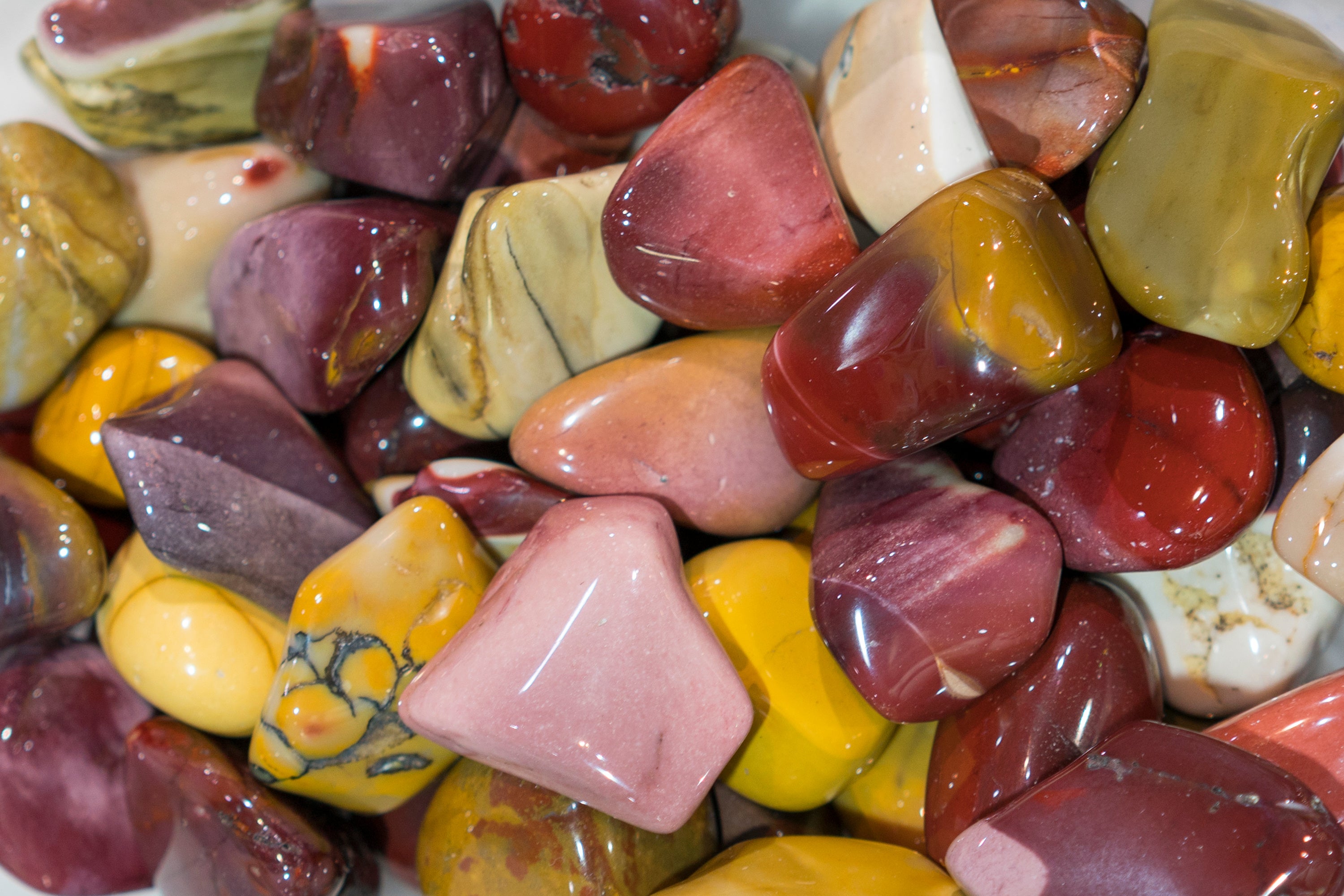 Adobe Stock photo close up of mookaite jasper tumbled stones
